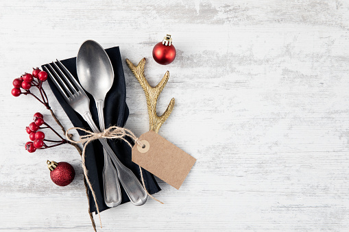 Holiday background with vintage place setting on old wooden table