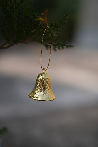 Christmas and new year decoration, Golden bells with blurred background.