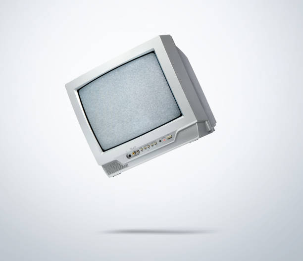 Working old CRT TV in the fall, noise and interference on the screen, on light gray background. File contains a path to isolation.