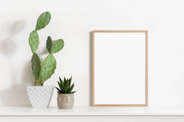 istock Artwork mockup in interior design. Blank picture frame on a wall 1445147643