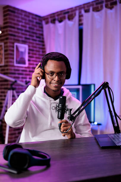 istock POV of freelancer using podcast equipment to broadcast live discussion 1445147678