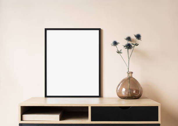 istock Artwork mockup in interior design. Blank picture frame on a wall 1445147746