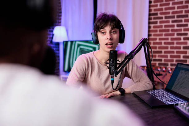 istock Lifestyle blogger having conversation with female guest 1445147786