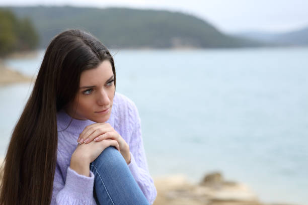 istock Woman thinking contemplating in nature 1445148028