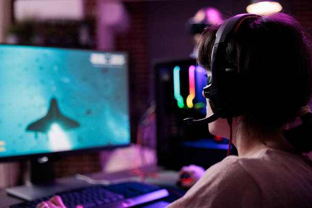 istock Happy woman streaming online multiplayer video games play 1445149418