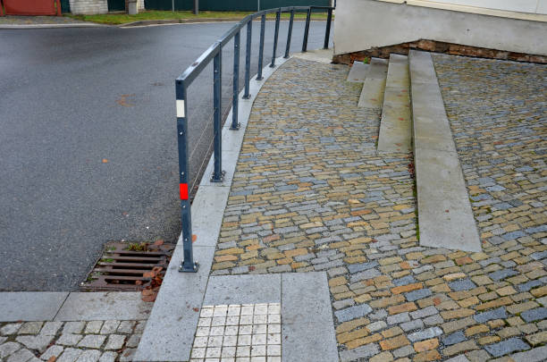 istock metal frames of railings are visually lightened by elegant stainless steel cables instead of horizontal bars. a intersection, they separate sidewalk school from road, students, accident, stone paving 1445149848