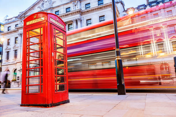 istock London red telephone booth and red bus in motion 1445151641