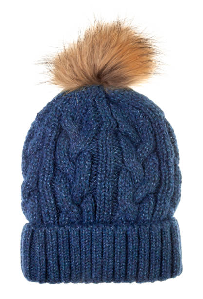 istock Knitted winter bobble hat with cable knitting ornament isolated on white 1445152506