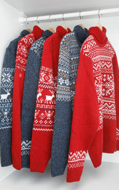 istock Collection of knitted Christmas turtleneck sweaters on hanger rack 1445152536
