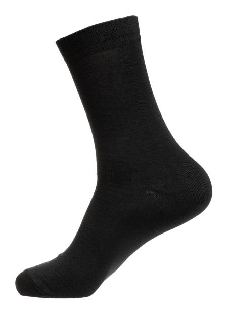 Long black sock on mannequin isolated on white stock photo