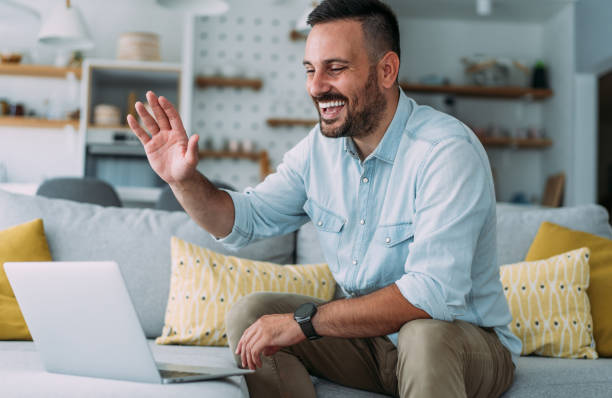 istock Man having video call at home. 1445153532