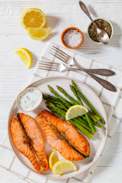 istock roast salmon steaks with asparagus and dill sauce 1445155233