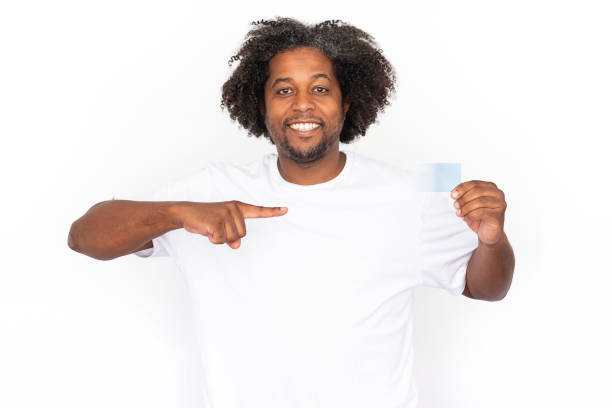 istock Cheerful African American man pointing at credit card 1445155297