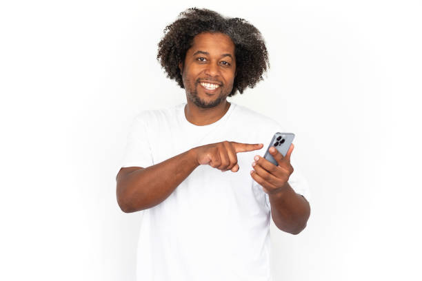 istock Happy African American man dialing ads number 1445155328