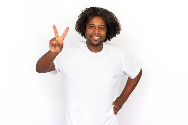 istock Happy African American man showing victory sign 1445155376
