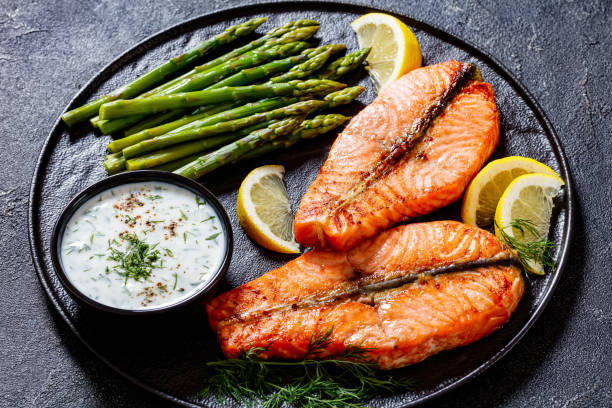 istock roast salmon steaks with asparagus and dill sauce 1445155529