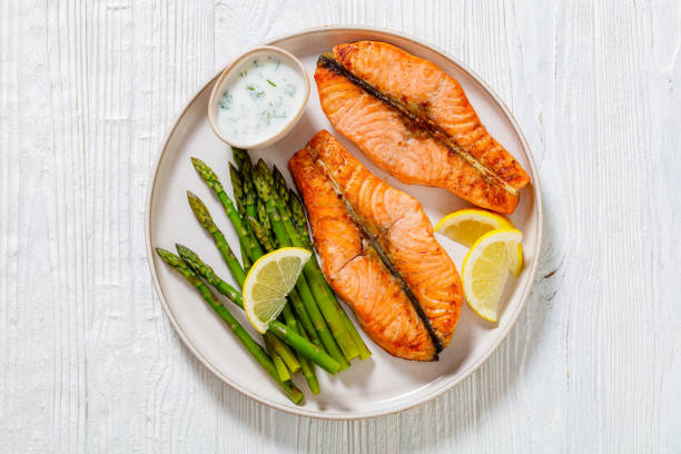 istock roast salmon steaks with asparagus and dill sauce 1445155669