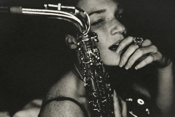 istock The young woman with the saxophone. 1445156218
