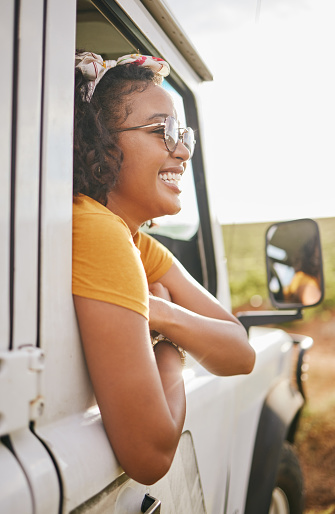 Girl, relax and window in off road car for summer travel holiday in the Colombia countryside. Colombian woman resting in vehicle for vacation journey with excited, happy and satisfied smile.