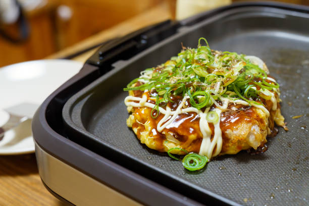 Japanese okonomiyaki on hot plate