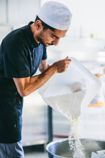 istock Italian chef pizzaiolo preparing pizza flour in restaurant kitchen 1445160761