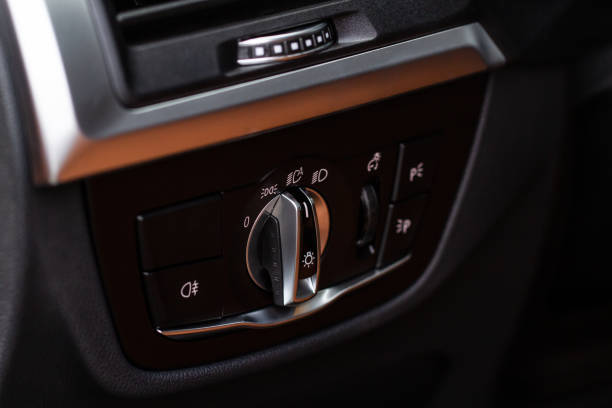 istock Closeup of the headlight switch control button. Lights control panel in car 1445161863