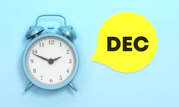 istock December written Yellow speech bubble and Blue Alarm Clock 1445162400