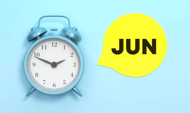 istock June written Yellow speech bubble and Blue Alarm Clock 1445163698