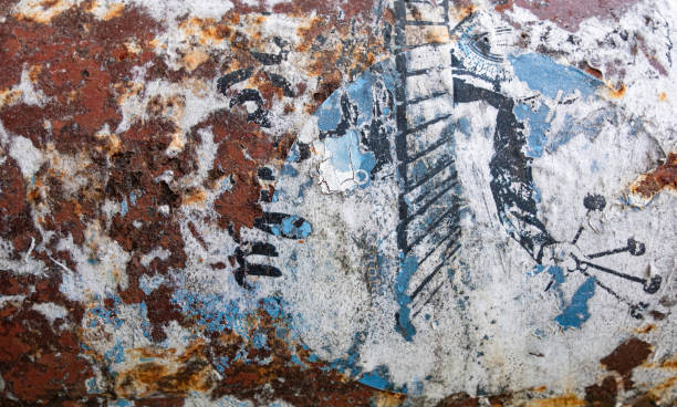 istock Corroded rusted pipe with peeling blue and white paper and paint grunge background texture 1445166085