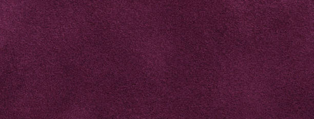 istock Texture of velvet matte dark purple background, macro. Suede wine fabric with pattern. Textile leather backdrop, 1445168741