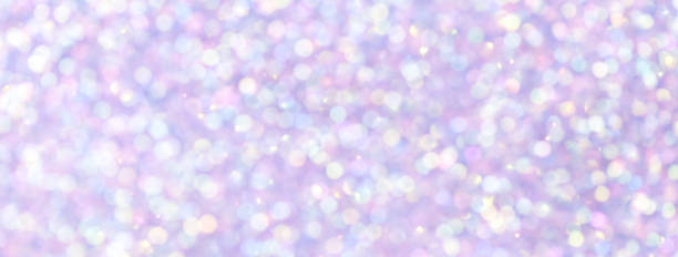 istock Blurred light purple and violet sparkling background from small sequins, macro. Lilac defocused backdrop 1445168856