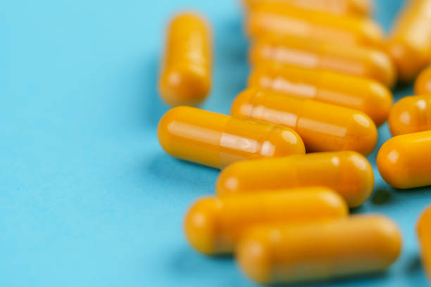 istock Turmeric herb yellow medicative capsules 1445169541