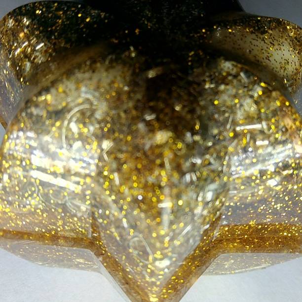 istock Defocused - Sparkling Golden Colored Orgonite 1445171886