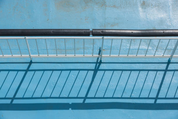 shadow of the railing on a ferry boat