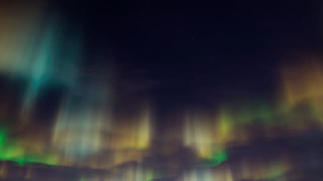 Aurora borealis or northern light dancing on the sky