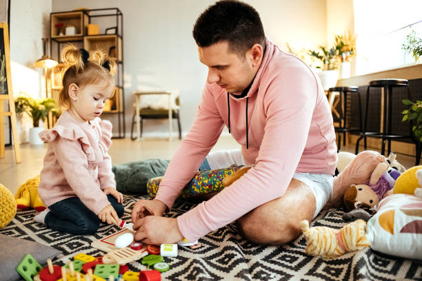 istock Happy little kid playing with caring father. 1445173298