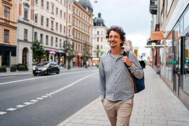 istock Young Man Walking On The Street In Stockholm 1445175708
