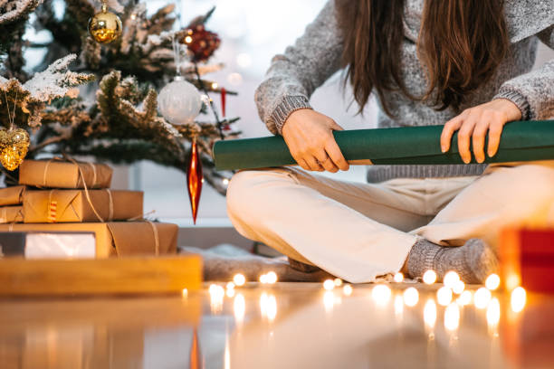 istock Rolling the wrapping paper for Christmas present 1445177352