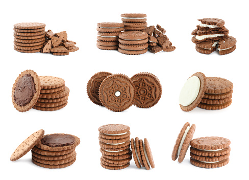 Set with tasty chocolate cookies with cream on white background