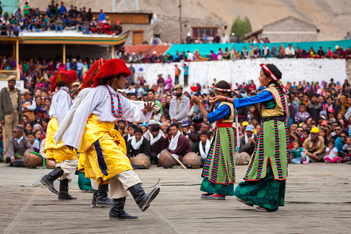 Leh, India - September 08, 2012: Young dancers in traditional Ladakhi Tibetan costumes perform folk dance at the Annual Festival of Ladakh Heritage in Leh, India. September 08, 2012