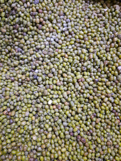 pile of green beans and soybeans in the market stock photo