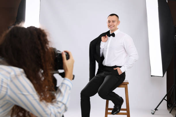 istock Handsome model posing for professional photographer in studio 1445180967
