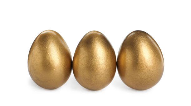 istock Many shiny golden eggs on white background 1445181247
