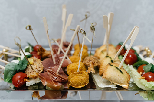 variation of finger food on skewers for business anniversary