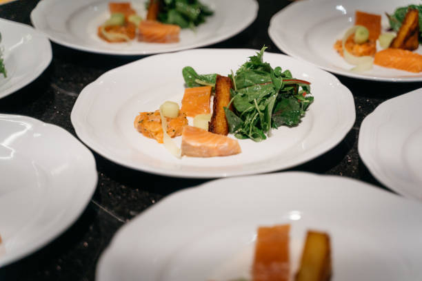 variation of salmon on leaf salads at fine dining