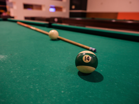 pool table, balls and cue