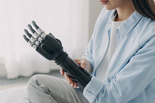 istock Application of bionic hands. Disabled woman customizing sensory robotic prosthetic arm, close up 1445187337
