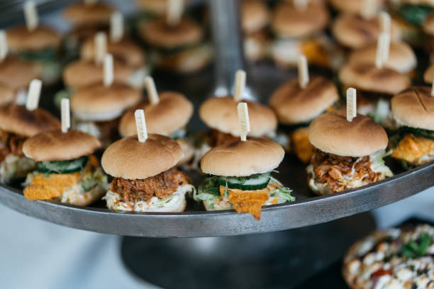 istock mini pulled pork burger with coleslaw and cucumber on a etagere 1445188096