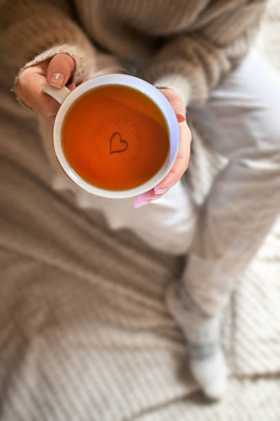istock Take your time. Girl Holding a Cup of Tea 1445189053