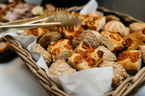 bread basket with different kinds of bread and foccacia